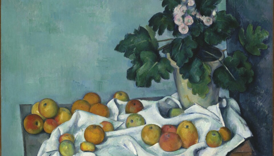 Stilleben med epler og primulaer, ca. 1890, av Paul Cézanne.